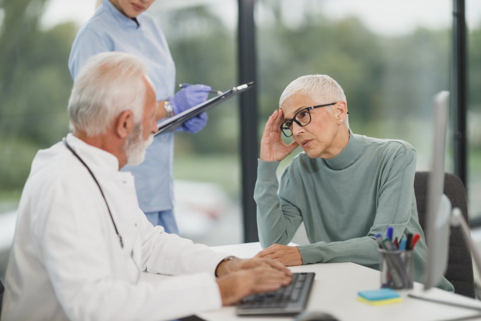 Doctor talking with a patient about health insurance coverage