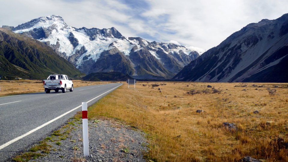 Car on an open road, safe driving habits lower insurance costs