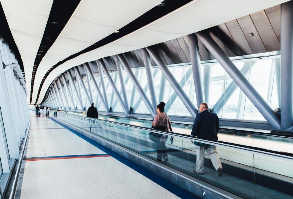 Traveller at an airport heading to Europe with travel insurance